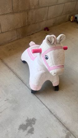 Baby and kids play horse