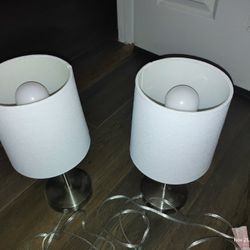 Two Silver Lamps With White Shades 