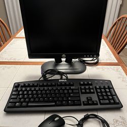 Dell, computer monitor with dell keyboard and a Microsoft mouse