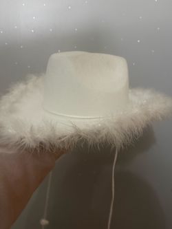 White fuzzy cowgirl hat