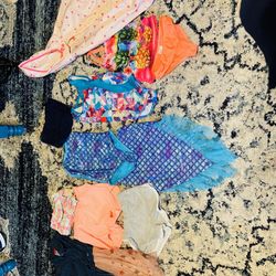 3 swimsuits a rain jacket 4 shorts and a dress Size 4/5