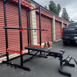 1000lb Rated Sunny Health And Fitness power Cage Combo With Fully Adjustable Bench And 300lb Olympic Weight Set With Barbell And Clips 