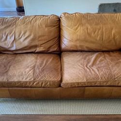 Real Leather couch, three seater, can deliver with deposit non refundable.