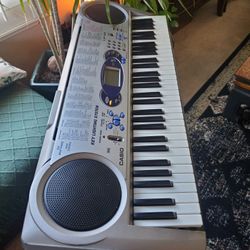 Casio Keyboard With Stand And Chair .Works Great And Lights Up. 