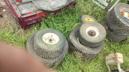 I have two complete sets of lawn mower tires and rooms they're cracked up I don't know if they hold air or not 40 bucks for both sets as is