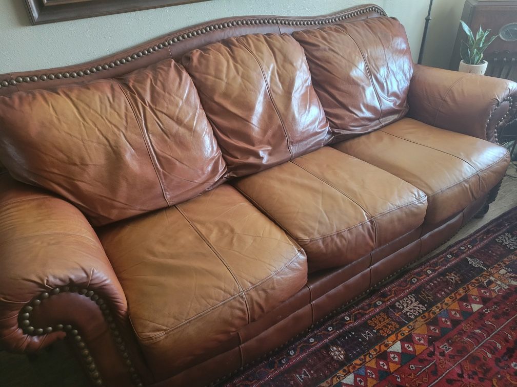 Brown leather studded sofa
