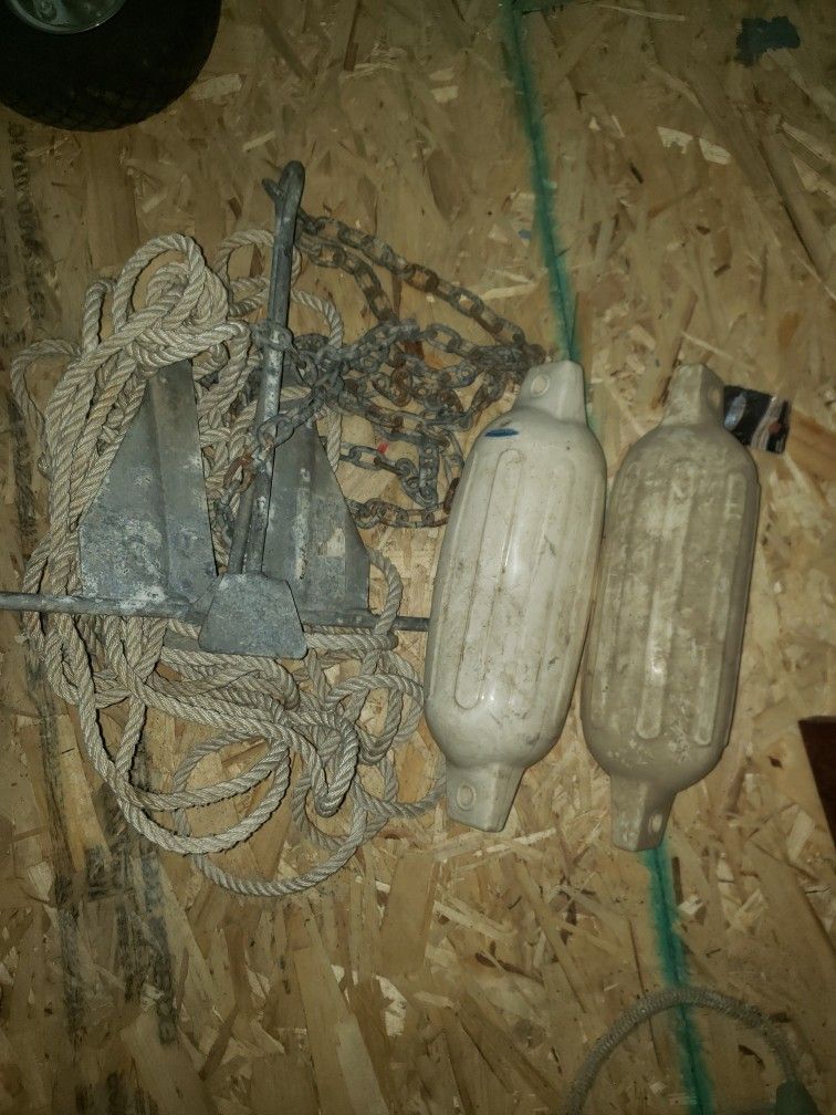 Small Anchor And Chain With Rope And Two Fenders