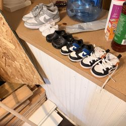 Baby Shoes And One Adult Shoes