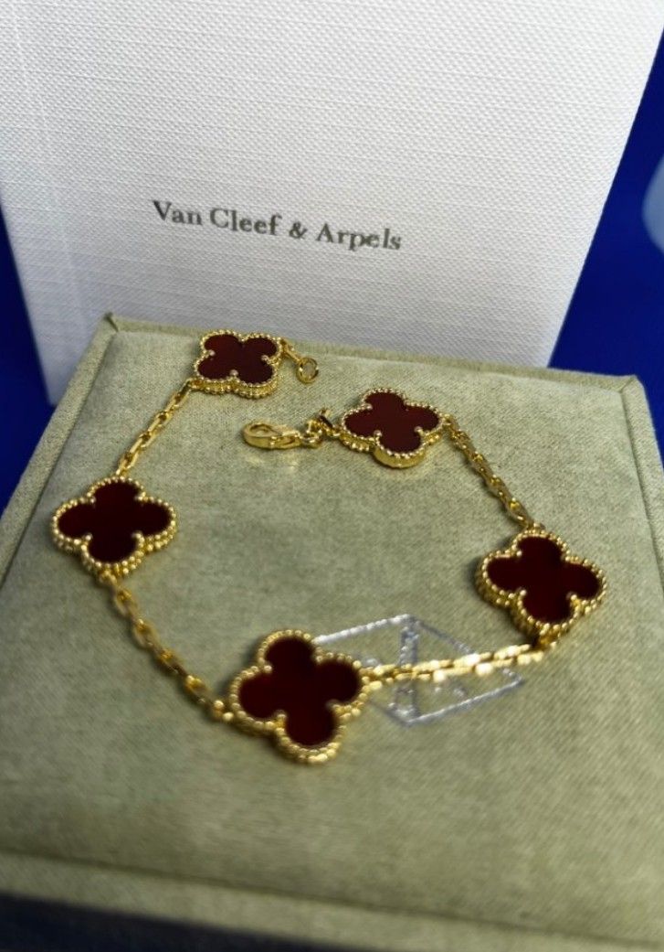 Rose gold bracelet with five red chalcedony clovers