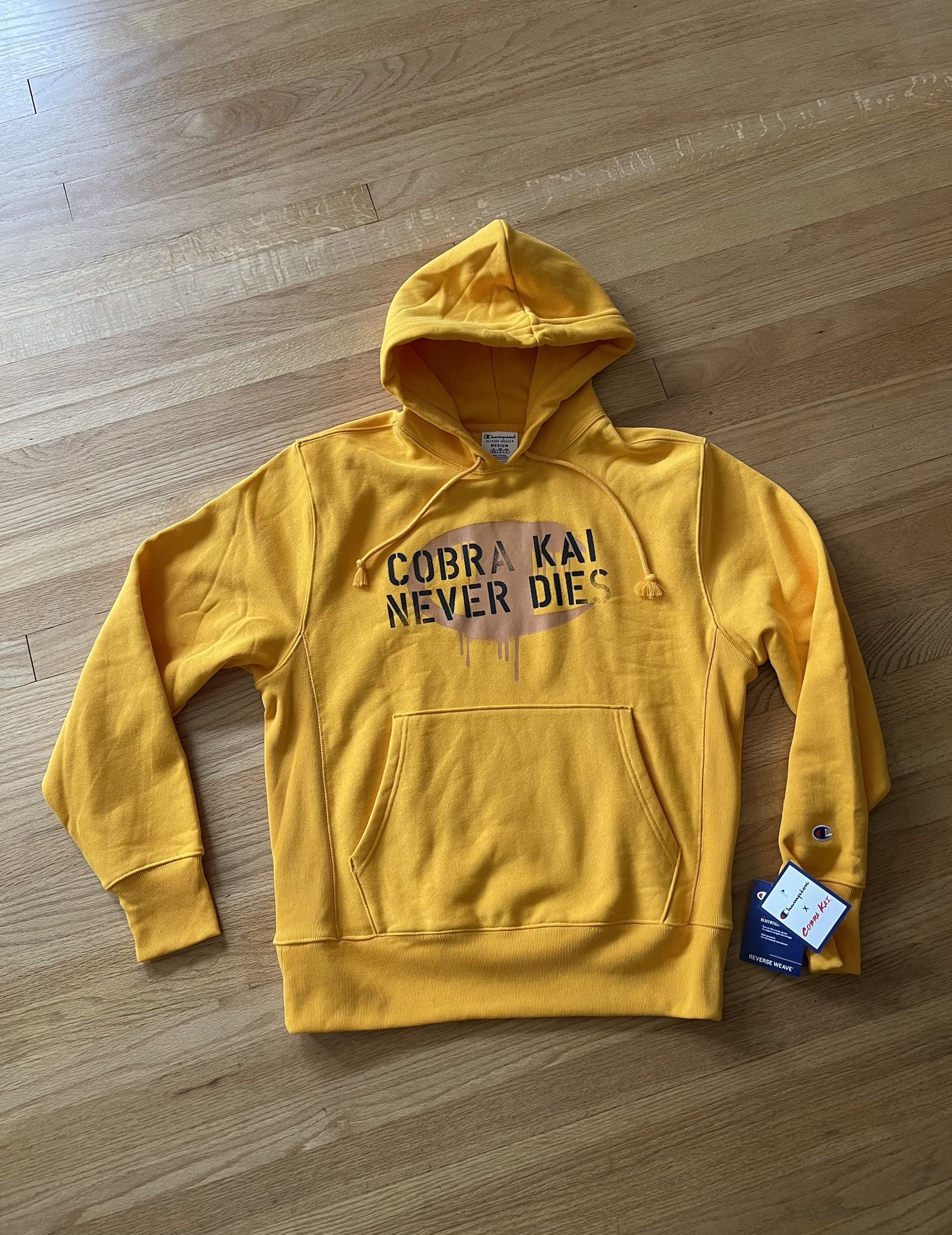 CHAMPION X Cobra Kai NEVER DIES Reverse Weave Yellow Hoodie NEW NWT Medium Mens