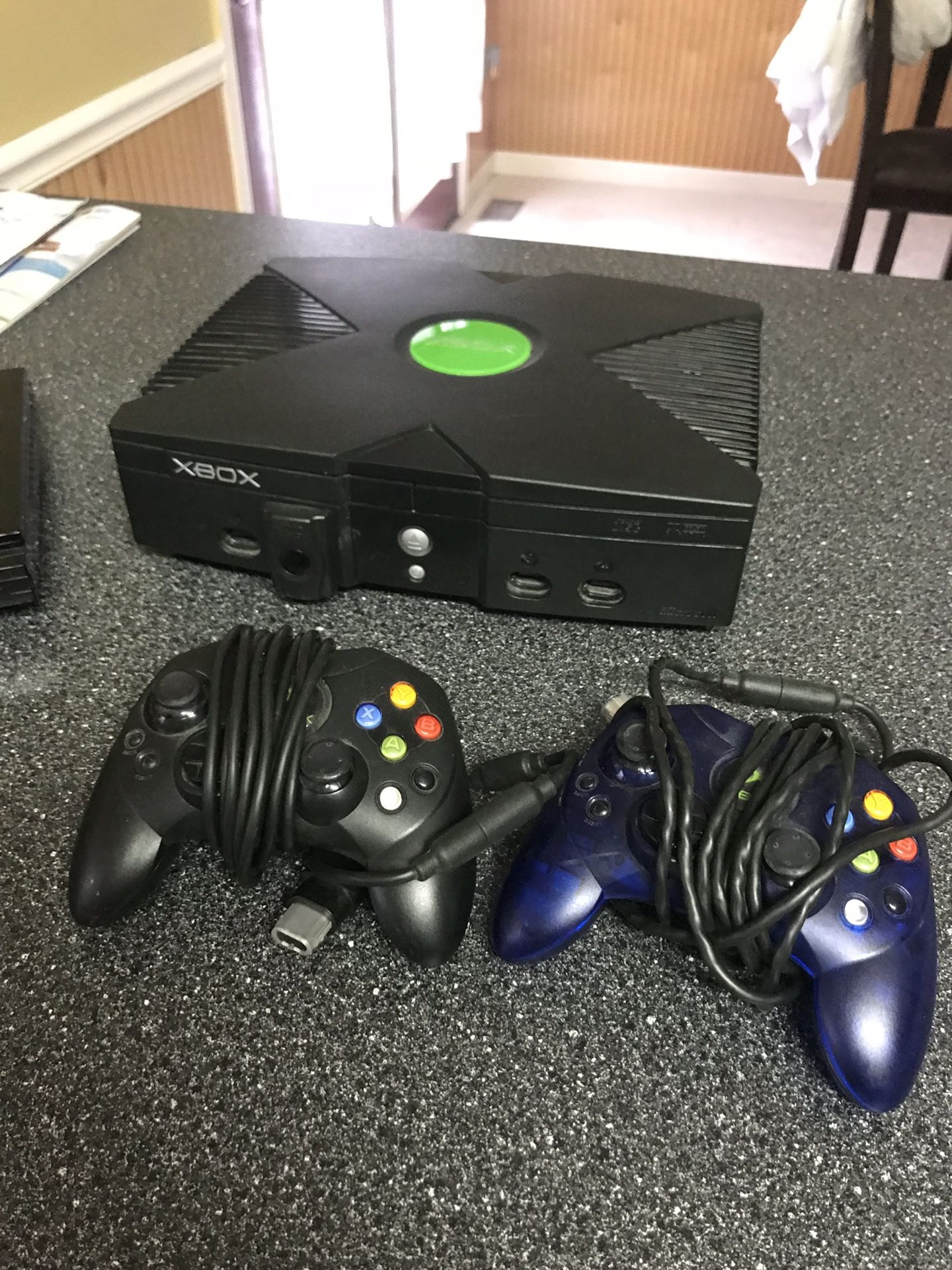 Black Xbox with controllers