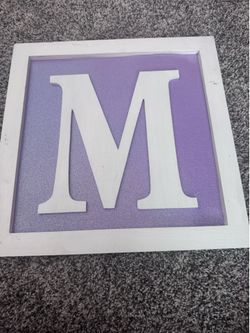 Framed M sign