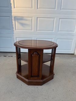 Vintage wooden tiered occasional or end table with a hexagonal base and multiple open shelf tiers