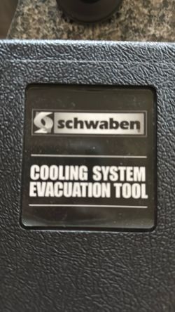 Schwann cooling system evacuation tool