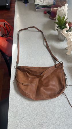 Brown cross body T-shirt and jeans brand