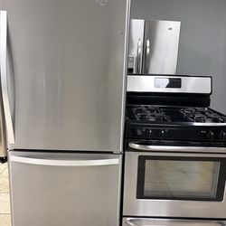 Whirlpool bottom freezer refrigerator &  Frigidaire gas range combo stainless steel