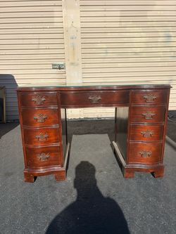 Antique desk and dresser with mirror.