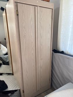 Closet with hanging pole and shelf