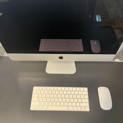 iMac (Retina 4K, 21.5-inch, 2017) with keyboard and mouse