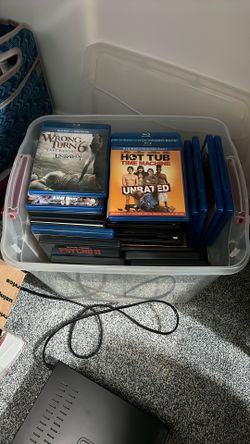 Assorted DVDs and Blu-ray plus Blu-ray player with remote