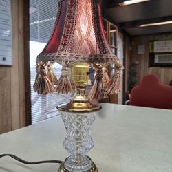  VERY UNIQUE LOOKING VINTAGE SMALL TABLE LAMP  BRASS AND GLASS  GOOD CONDITION 13.5 INCHES TALL  THIS LAMP WORKS GREAT  REALLY NEAT LOOKING SHADE 