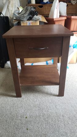 End table, wood with solid drawer with cardboard back.