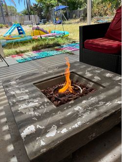 Fire pit with a tank
