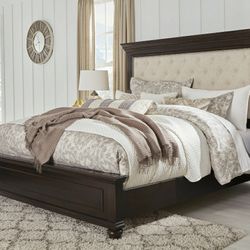 Brynhurst Dark Brown Queen Upholstered Panel Bed

