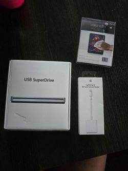 Apple USB SuperDrive CD/DVD player, lightning to SD card camera reader, cleaning cloth.