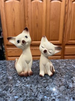 Vintage Siamese Cat Pair of Salt and Pepper Shakers. Tallest is 5 inches tall. Preowned the shortest cat has tiny chip on one ear. See pictures.