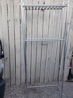 Metal bathroom shelf goes over the top of the toilet
