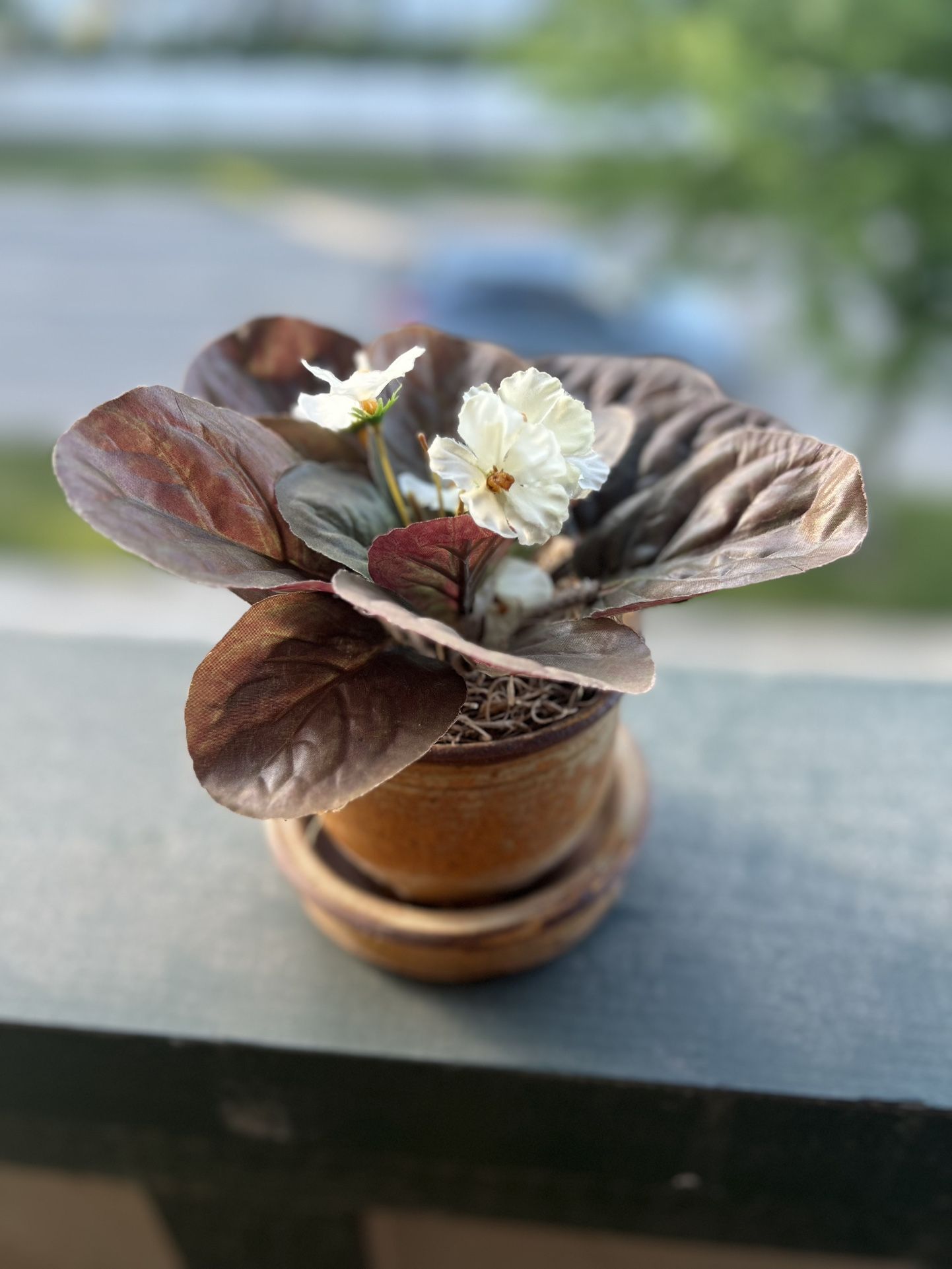 Small fake flower in a planter