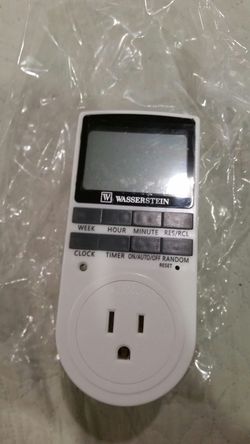 Programable plug-in digital light timer switch.
