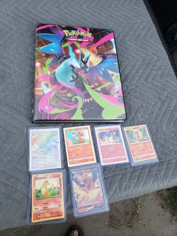 Just Rainbow Charizard is $150! Plus 260 Holo Glowing Cards $800! The other Pokémon Cards Trainer & Pokéballs holo with gold Cards $800! All for $1400