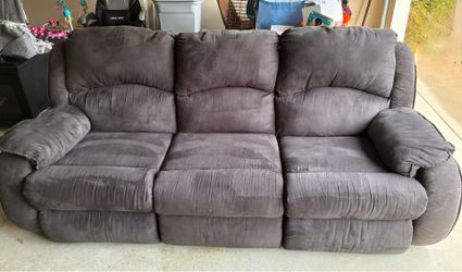 Gray couch with 2 reclining seats