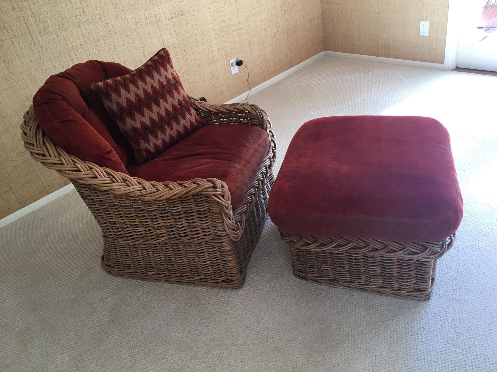 McGuire cane chair with ottoman. Red suede cushions.