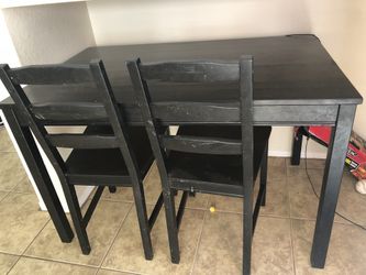 Dark wood table with chairs