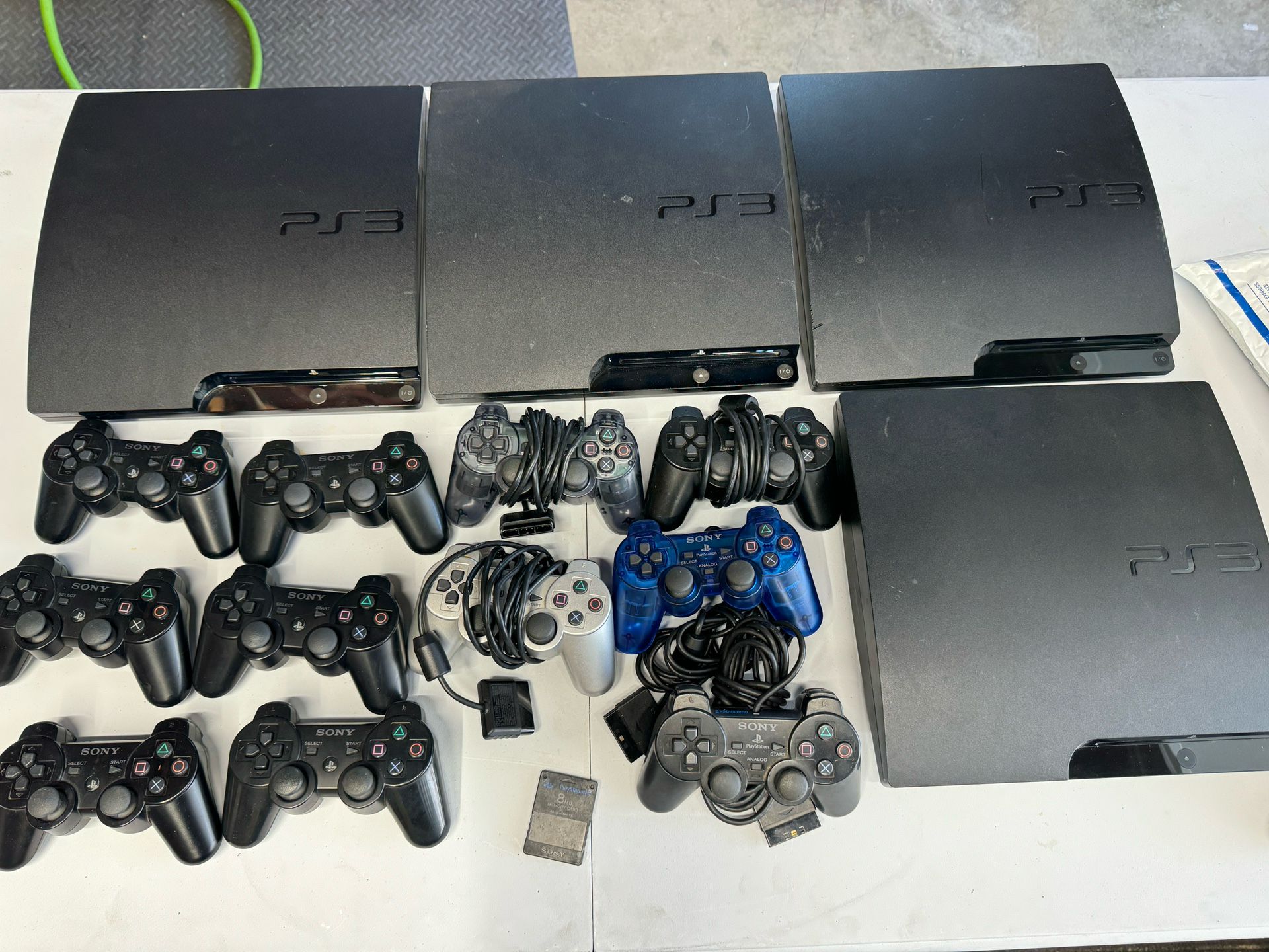 4 PS3 Slims, 3 PS3 Fats And 11 Controllers