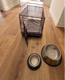 Small dog crate with bowls