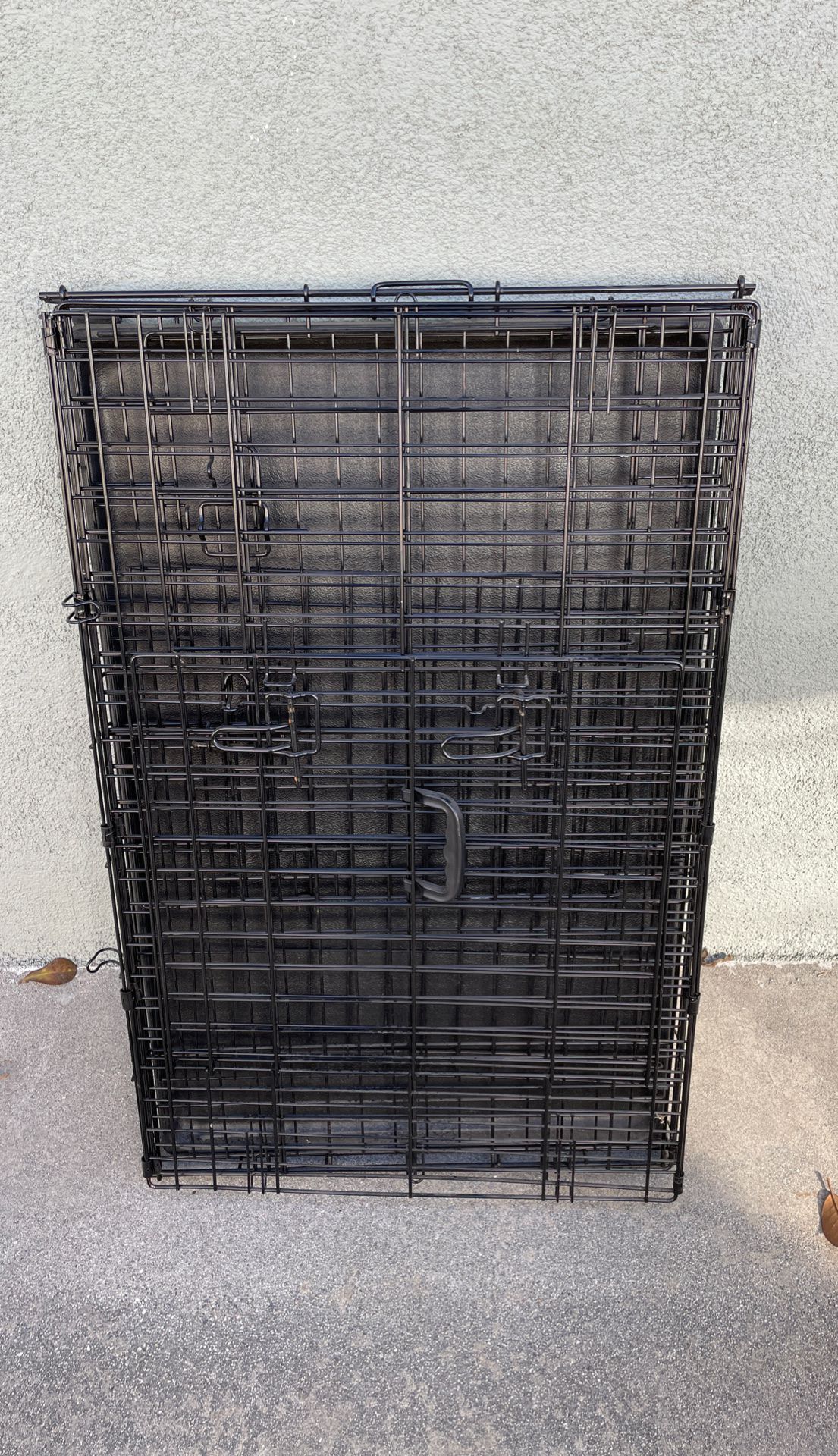 Dog crate approximately 24”x36”