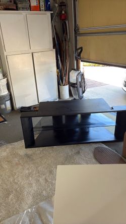 Black tv stand with glass shelf