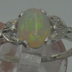 14KT WHITE GOLD  FASHION RING WITH OVAL OPAL AND 4 SMALL DIAMONDS 2.9GR SIZE 8.75. 854346-1.