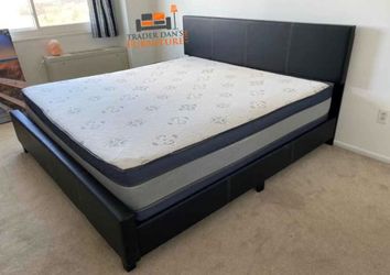 King size bed frame with a mattress