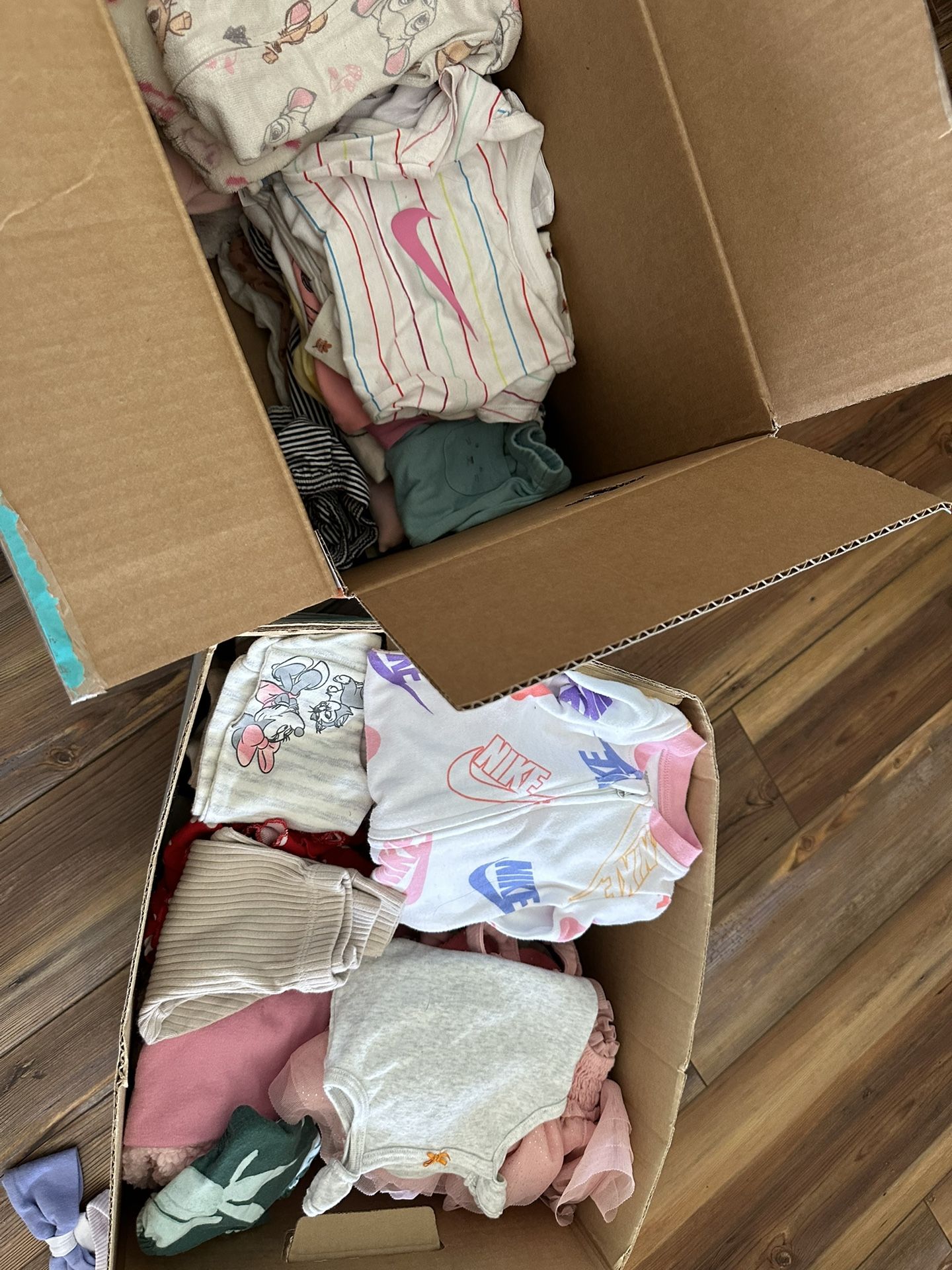 2 boxes of baby clothes