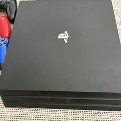 PS4 Pro With Controllers And Games 
