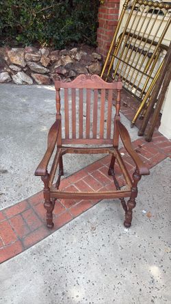 Vintage wooden armchair with cane seat