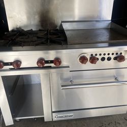 Estufa 4 quemadores y plancha y horno