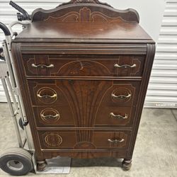 vintage Art Deco "waterfall" style mahogany dresser with original brass hardware. 