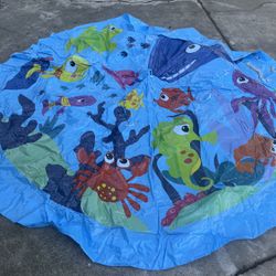 Kids Splash Pad / Play Mat – Ocean Theme  Bright, fun ocean-themed kids splash pad/play mat in good condition. Perfect for summer play, backyard fun, 