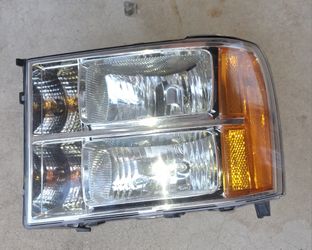 2007-2013 GMC Sierra left driver side headlight with bulbs